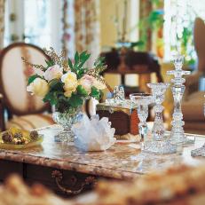 Ornate Coffee Table With Fresh Flowers and Crystal Candleholders