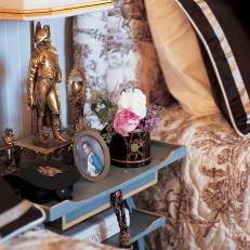 Nightstand With Gold Figurine Lamp