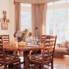 Transitional Dining Room with Round Table and Large Window