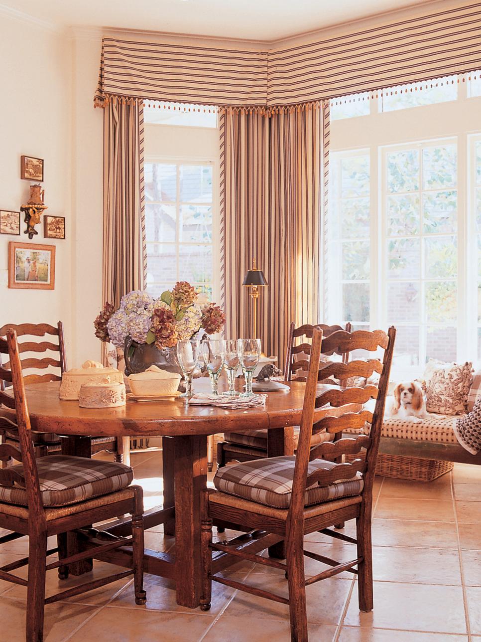 Transitional Dining Room With Round Table And Large Window Hgtv