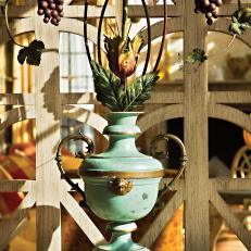 Decorative Tole Painted Urn With Wood Lattice Backdrop