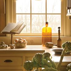 Country Kitchen Window View with Limed Oak Cabinetry and Concrete Countertops