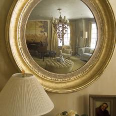 Oval Mirror Reflects Sitting Room
