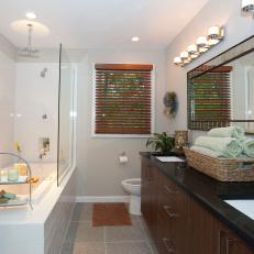 Gray Bathroom With Subway-Tile Tub Surround