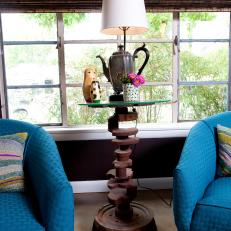 Eclectic Side Table With Blue Club Chairs