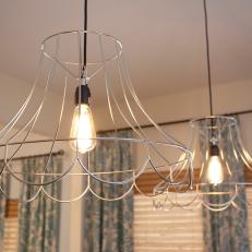 Dining Room With Wire Lampshade Pendants