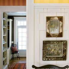Traditional Entryway Features Striped Wallpaper & White Paneling