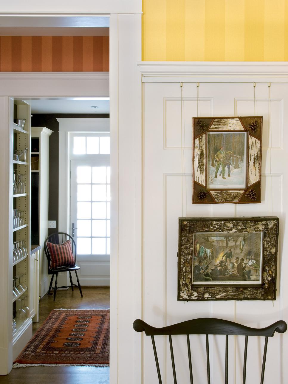 Traditional Entryway Features Striped Wallpaper & White Paneling | HGTV