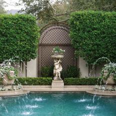Swimming Pool With Garden Statue And Water Fountains