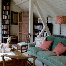 Country Home Office With White Wood Walls and Green Couch