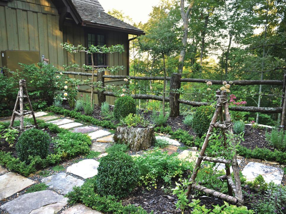 small kitchen garden with rustic wood fence hgtv