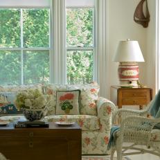 Bright Sunroom With Floral Sofa and Coffee Table Chest