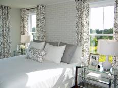 Gray and White Bedroom with Exposed Brick Wall