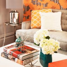 Modern Orange and Brown Living Room With White Coffee Table