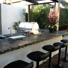 Contemporary Outdoor Kitchen With Black Barstools