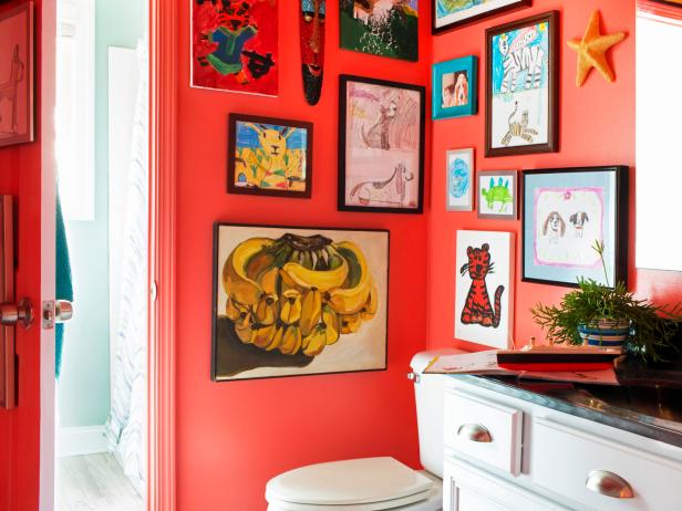 Red Kids' Bathroom With Framed Children's Artwork