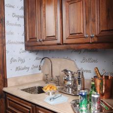 Traditional Party Ready Wet Bar With Whimsical Wallpaper