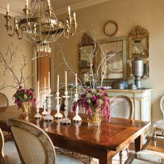 Formal Dining Room With Gold Patterned Chairs & Brass Chandelier