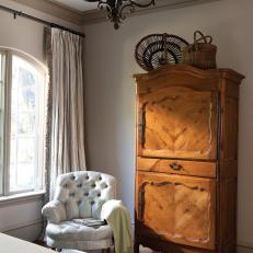 Neutral Traditional Bedroom With Ornate Wood Armoire