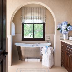 Rustic Neutral Bathroom with Exposed Beams and Stone Mosaic Floor