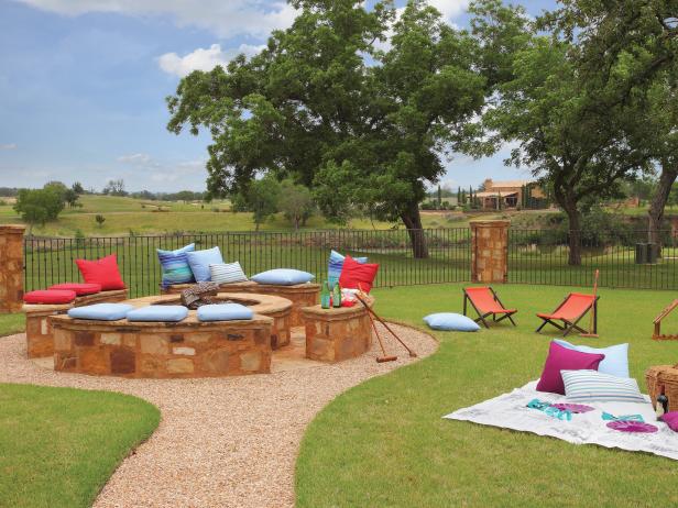 Rustic Outdoor Fire Pit With Stone Benches Cushion Seating Hgtv Rustic Outdoor Fire Pit With Stone Benches Cushion Seating