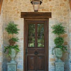 Custom Mediterranean Wood Front Door With Wrought Iron