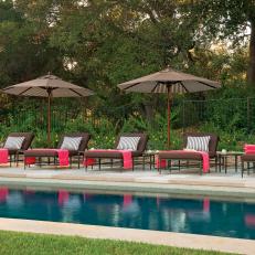 Sleek Swimming Pool With Brown Lounge Chairs