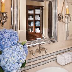 Neutral Bathroom With Tiled Backsplash & Silver Mirror