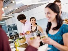 Guests in Kitchen at Dinner Party