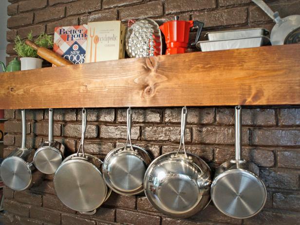 In just a few hours, turn inexpensive, easy-to-find materials into wall-mounted storage for a cabinet full of pots and pans, plus your favorite cookbooks and kitchen essentials.
