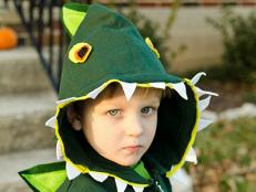 Child in Halloween Dinosaur Costume
