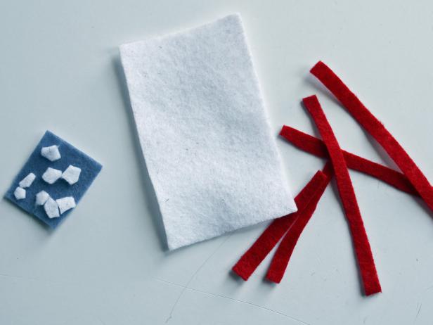 Create patches by cutting then piecing together pieces of felt with fabric glue. Make flags, stars, chevrons, ribbons or medals — let your imagination go wild.