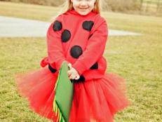 A handmade tulle tutu, basic red sweatshirt and felt are all you need to craft this cute ladybug costume complete with a personalized leafy trick-or-treat tote bag.