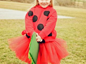 Girl wearing ladybug Halloween costume