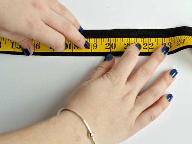 Measure child's waist then transfer that measurement to black elastic band. Mark with a pencil then cut band at marked line.