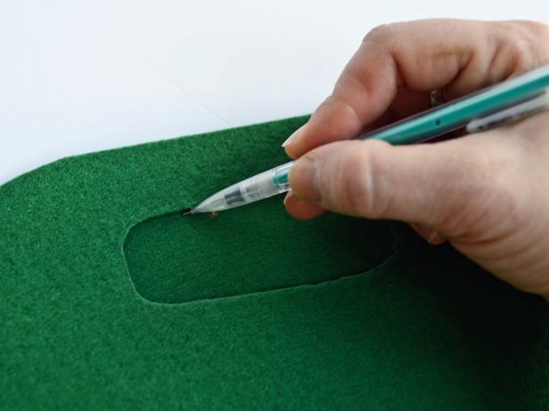 With a pencil, draw a handle centered width-wise on bag, about one inch down from top edge.