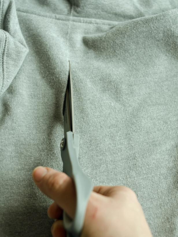 Cut slit for fin about halfway up sweatshirt back.