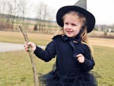 A no-sew tutu, pointy craft-foam hat, DIY broom and striped tights are paired with a black T-shirt for a wee witch's costume that's cute enough to cast a spell on even the biggest Halloween humbugs.