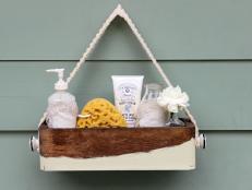 Rustic bathroom caddy made from an old wooden box. 