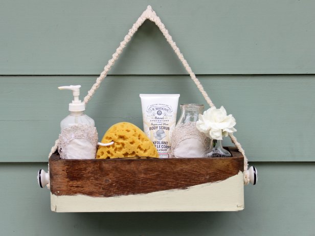 Rustic bathroom caddy made from an old wooden box. 