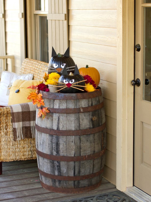 Welcome trick-or-treaters with a litter of black cat pumpkins near your front door. They're easy to create, and you can display them for years to come.