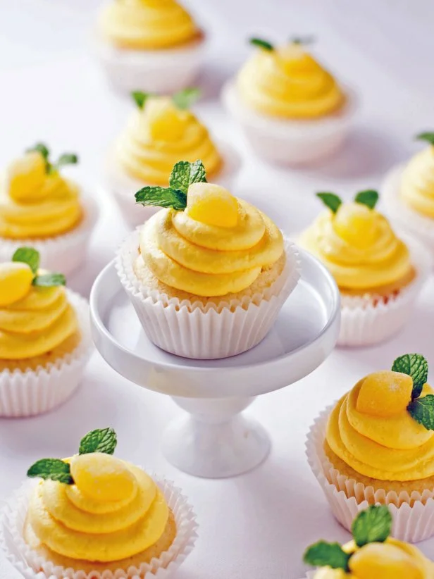 Lemon Cupcakes on a White Cake Stand. 