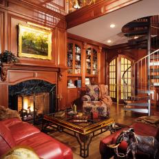 Home Library With Rich Wood and Spiral Staircase