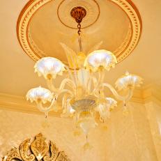 Ceiling With Gold Molding and Chandelier