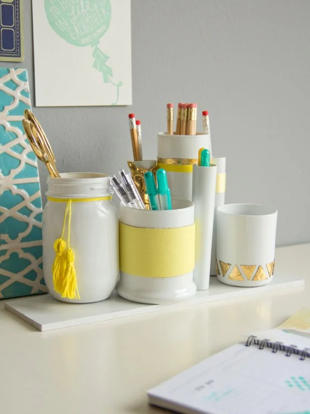 White and Yellow Containers Holding Desk Accessories