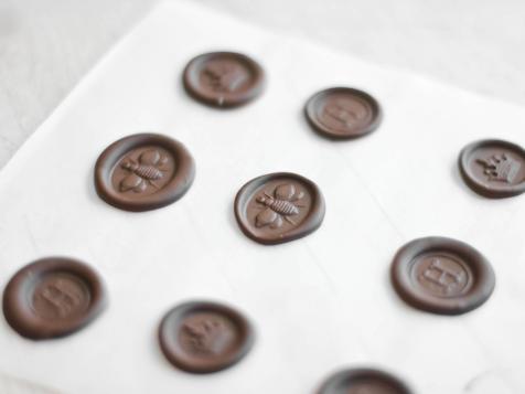 Chocolate Wax Seals on Poured Fondant Honey Cupcakes - Sprinkle Bakes