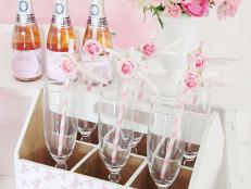 Floral Crate With Wine Flutes, Vase of Roses, Champagne Bottles
