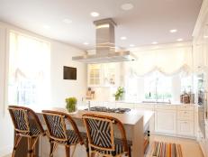 Designer Laura Umansky remodels a kitchen and breakfast room to create an open space with traditional and modern details.