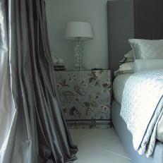 Gray Floral Skirted Bedside Table and Gray Curtain