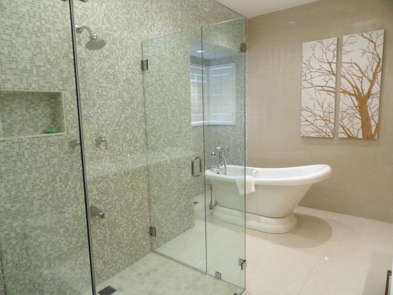Neutral Bathroom With Glass-Enclosed Shower & White Soaking Tub